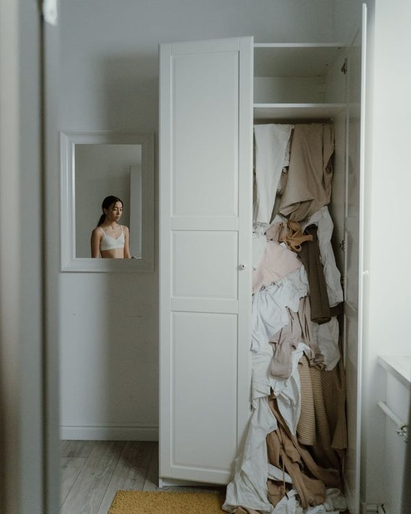 Woman feeling energized and full of life in a modern, minimalist space.